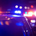 Police car lights flashing in the dark night