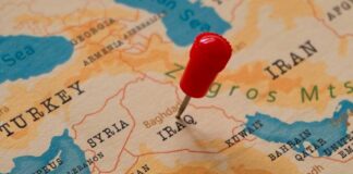 A map of the Middle East with a red pin marking Iraq