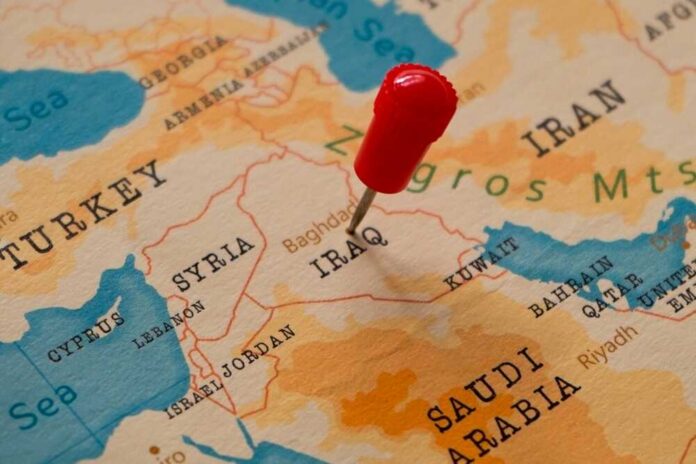 A map of the Middle East with a red pin marking Iraq