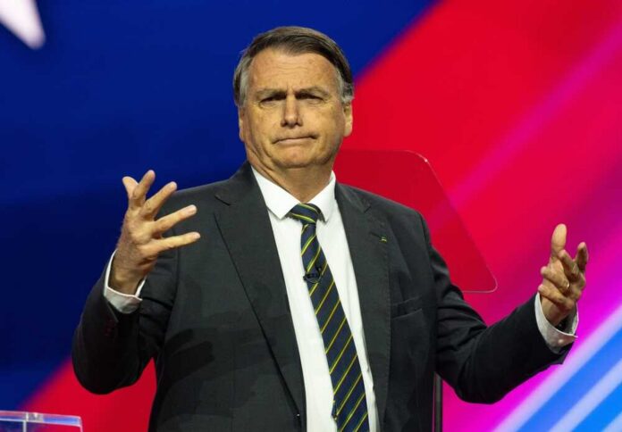 A politician gesturing while speaking at a podium