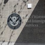 Signage for U.S. Citizenship and Immigration Services on a building