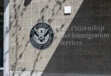 Signage for U.S. Citizenship and Immigration Services on a building