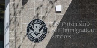 Signage for U.S. Citizenship and Immigration Services on a building