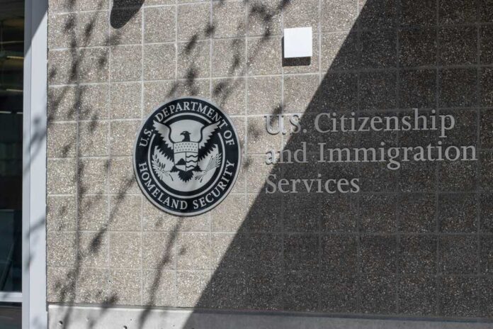 Signage for U.S. Citizenship and Immigration Services on a building
