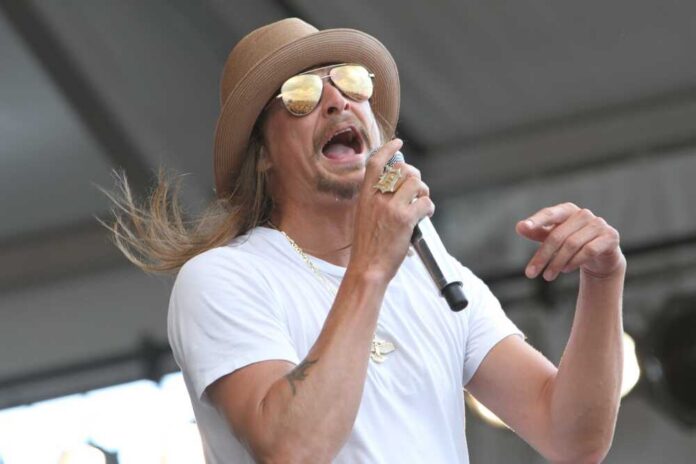 Musician performing on stage with a microphone