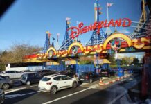 Entrance to Disneyland with cars waiting in line
