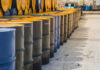 Rows of oil barrels in an industrial setting