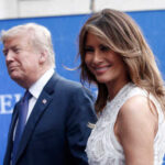 A couple at a political event, with one person smiling at the camera