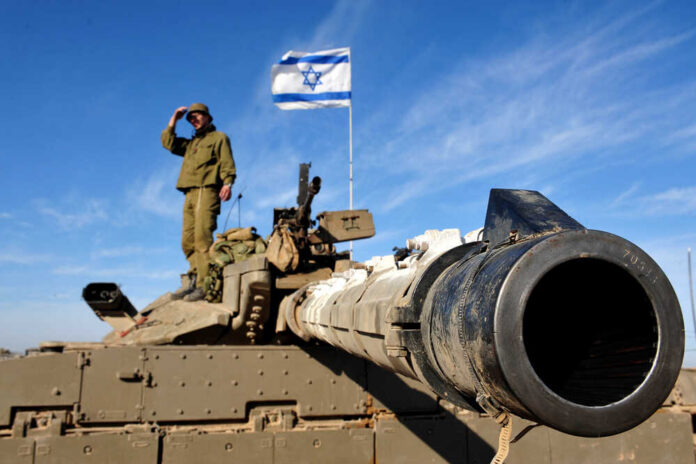 Soldier saluting from atop a tank with an Israeli flag in the background