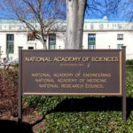 Sign for the National Academy of Sciences in front of a building