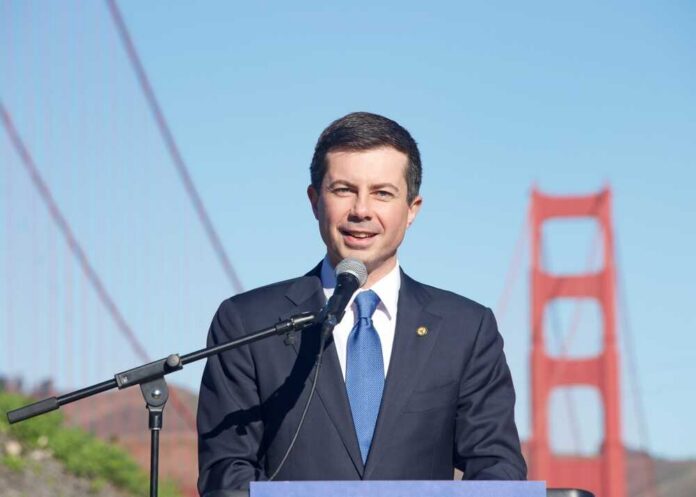 A man speaking at a podium with the Golden Gate Bridge in the background