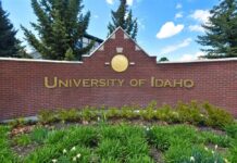 Sign for the University of Idaho displayed on a brick wall