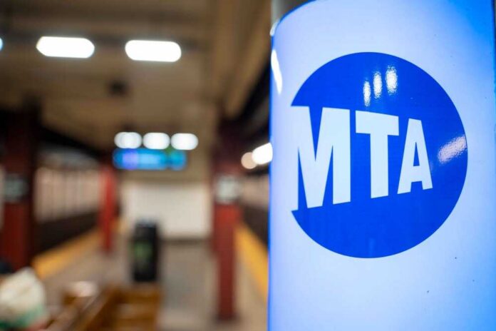 MTA sign in a subway station with blurred background