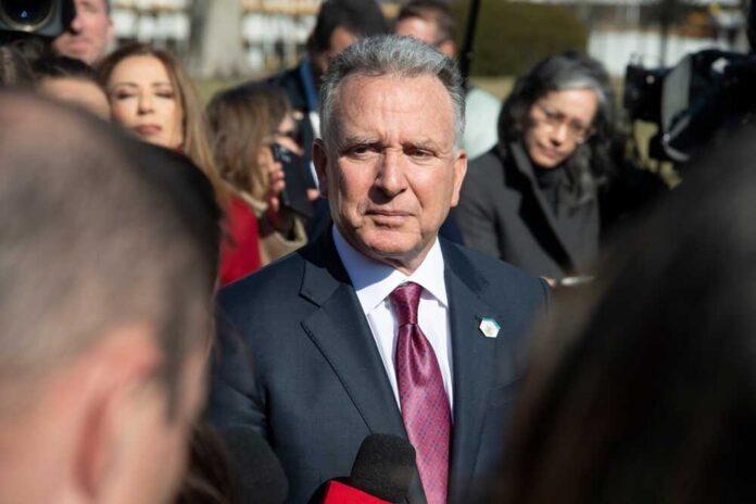A politician speaking to the media during a press conference