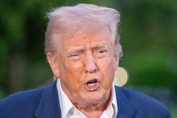 A political figure speaking passionately outdoors