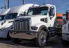 White heavy-duty semi truck in a dealership lot