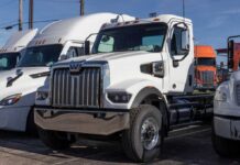 White heavy-duty semi truck in a dealership lot