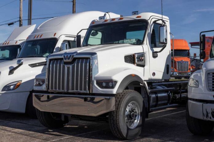 White heavy-duty semi truck in a dealership lot