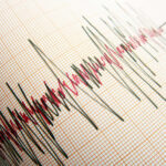 Seismograph displaying earthquake activity on graph paper