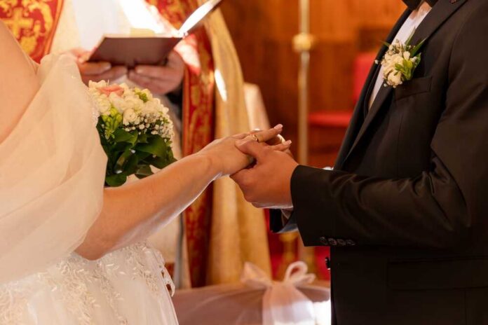 Bride and groom exchanging rings during a wedding ceremony