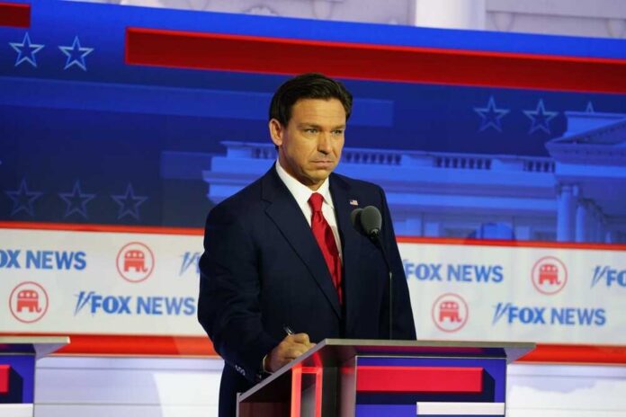 A political candidate standing at a podium during a debate