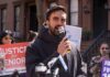 Man speaking into a microphone at a protest for senior justice