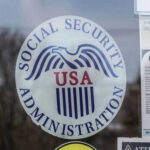 Social Security Administration USA logo on glass door.