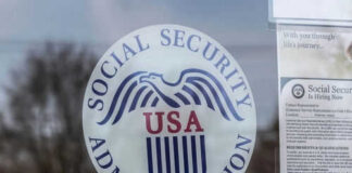 Social Security Administration USA logo on glass door.