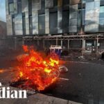 Bus and cars burned in anti-immigration protests in Belfast after stabbing