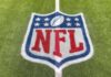 NFL logo painted on a football field