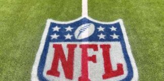 NFL logo painted on a football field