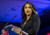 Woman speaking at a podium with microphone