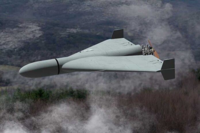 Flying wing drone with pusher propeller over foggy forest
