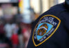 NYPD officer uniform badge closeup in NYC