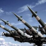Surface-to-air missiles mounted on a launcher against a blue sky