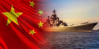 Chinese flag overlay with a large naval warship at sea
