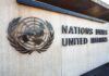 United Nations emblem and signage on a concrete wall