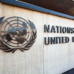 United Nations emblem and signage on a concrete wall