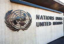 United Nations emblem and signage on a concrete wall