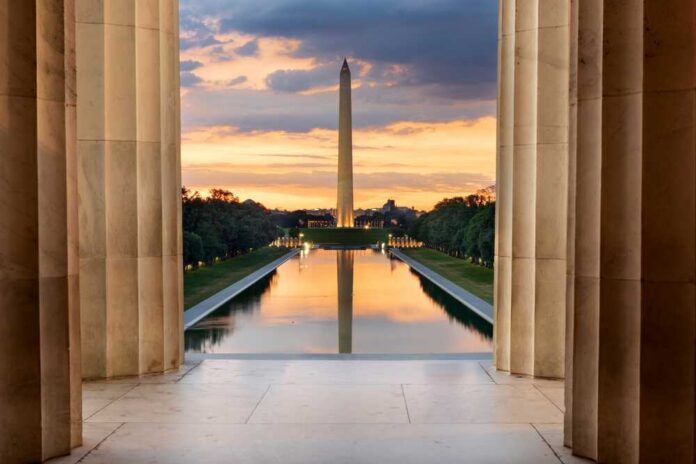 Washington Monument reflected in the Reflecting Pool at sunset