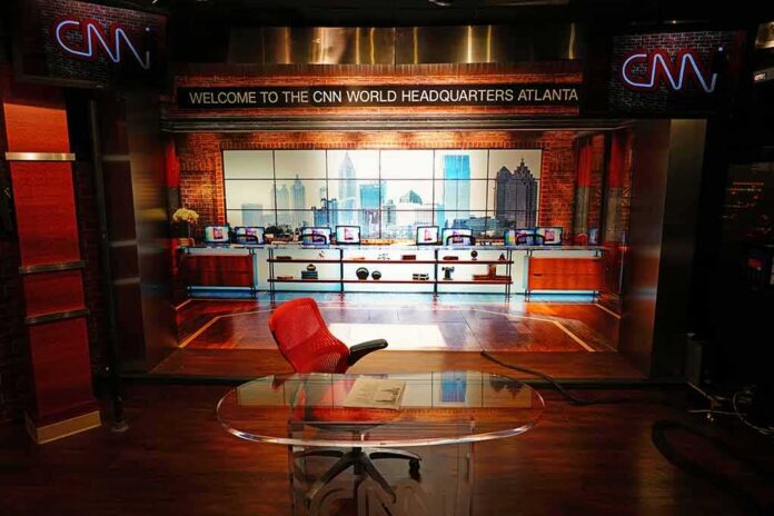CNN studio set with empty anchor desk and red chair