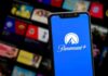 Smartphone showing Paramount+ app on blue screen