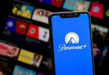 Smartphone showing Paramount+ app on blue screen