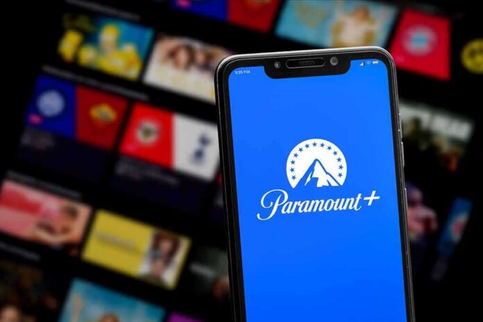 Smartphone showing Paramount+ app on blue screen