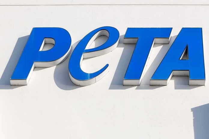 shutterstock_1022352409 Blue PETA sign on a white wall