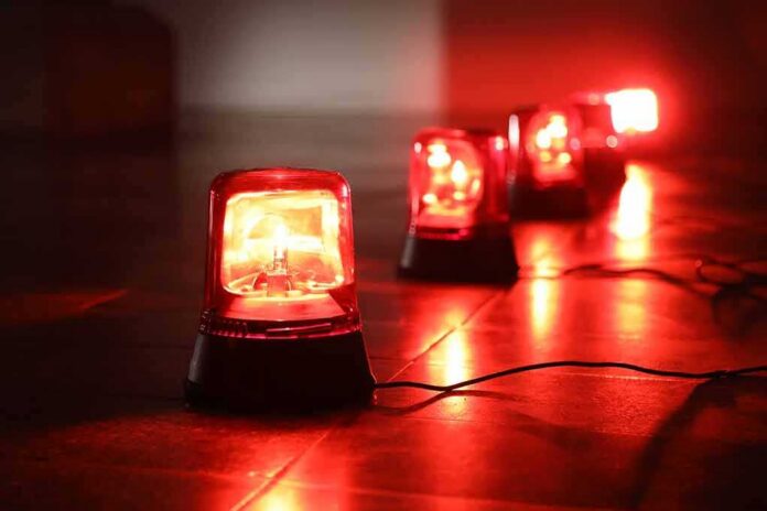 Red emergency beacons on a floor