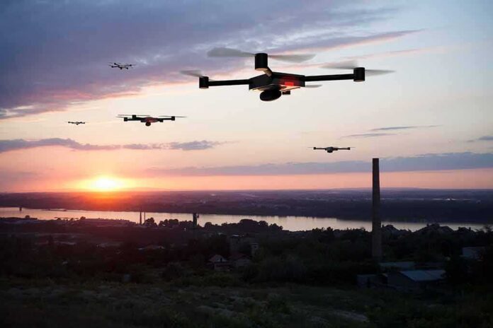 shutterstock_1143966755 Drones flying over a river landscape at sunset