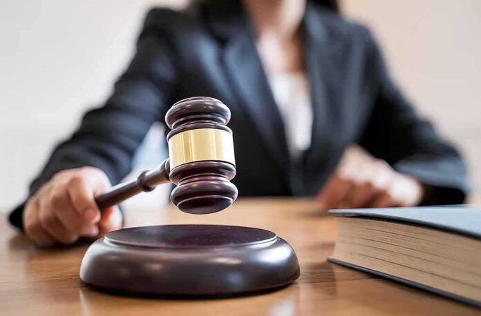 shutterstock_1278676255 Judge's gavel striking sound block on courtroom desk