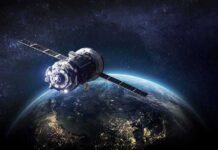 Satellite orbiting Earth over night side