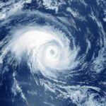 Hurricane swirling over the ocean from above